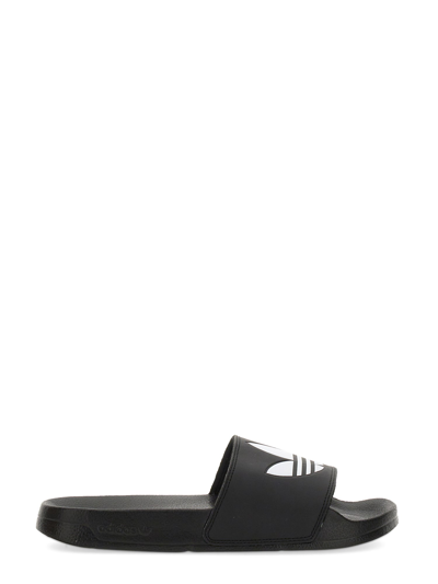 Shop Adidas Originals Slide Sandal With Logo In Black