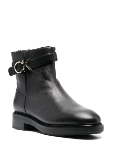 Shop Calvin Klein Logo-buckle Ankle Boots In Black