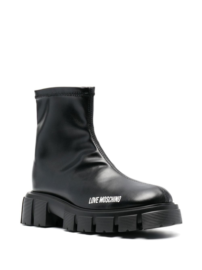 Shop Love Moschino 50mm Logo-print Studded Sole Boots In Black