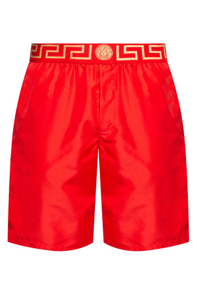 Shop Versace Greca Waistband Swim Shorts In Red