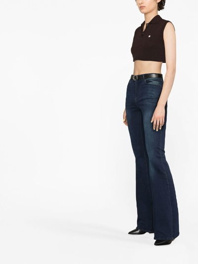 Shop Frame Low-rise Flared Jeans In Blue