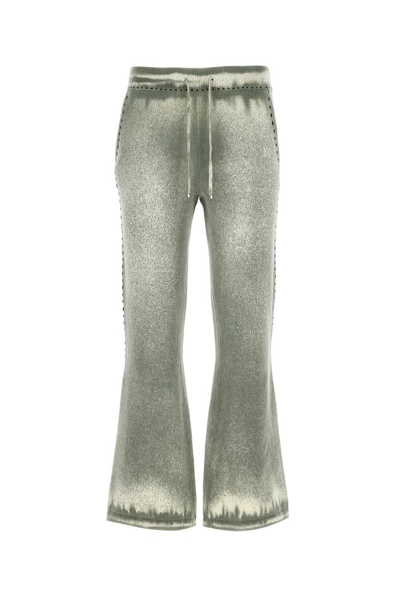 Shop Amiri Pigment Spray Flared Pants In Green