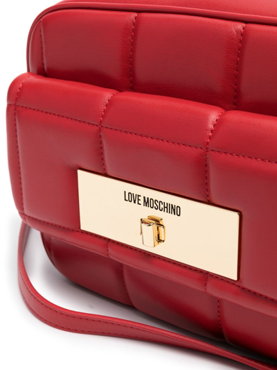Shop Love Moschino Engraved-logo Quilted Crossbody Bag In Red