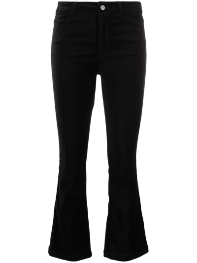 Shop Paige Mid-rise Flared Jeans In Black