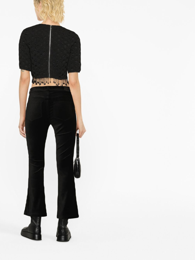 Shop Paige Mid-rise Flared Jeans In Black