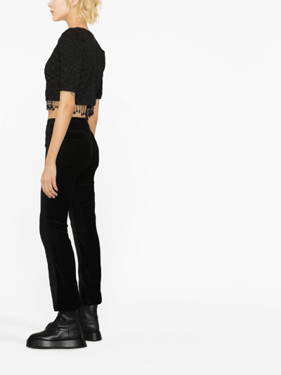 Shop Paige Mid-rise Flared Jeans In Black