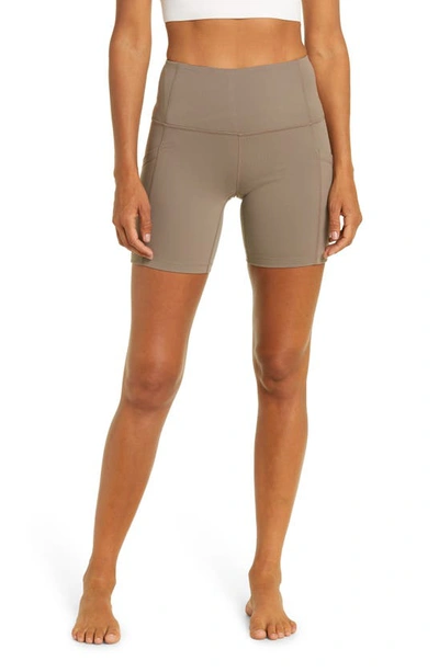 Shop Zella Live In High Waist Pocket Bike Shorts In Brown Falcon