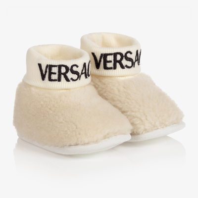 Shop Versace Ivory Sheepskin Logo Booties