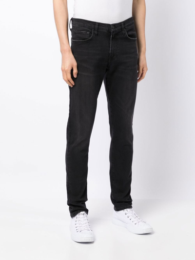 Shop Citizens Of Humanity London Tapered Jeans In Black