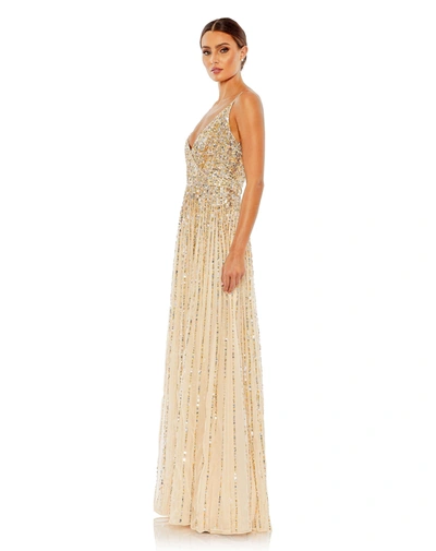 Shop Mac Duggal Sequined Sleeveless Wrap Over A Line Gown - Final Sale In Nude