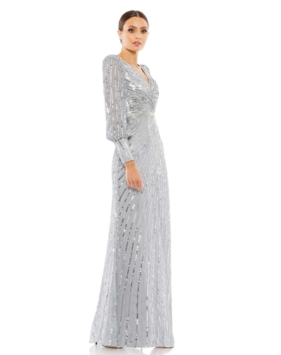 Shop Mac Duggal Sequined Wrap Over Bishop Sleeve Gown In Silver