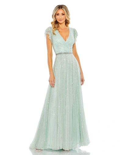 Shop Mac Duggal Sequined Wrap Over Ruffled Cap Sleeve Gown In Seamist