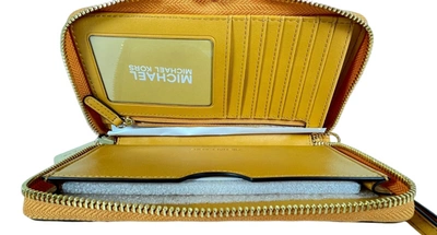 Shop Michael Kors Jet Set Travel Large Flat Multifunction Phone Case Leather Wristlet Wallet In Marigold/gold
