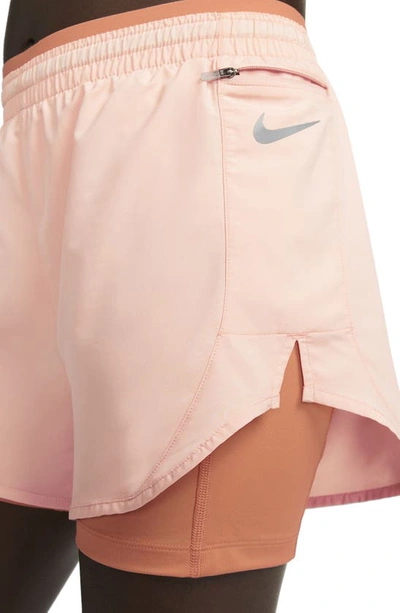 Shop Nike Tempo Luxe 2-in-1 Shorts In Arctic Orange/ Orange Trance