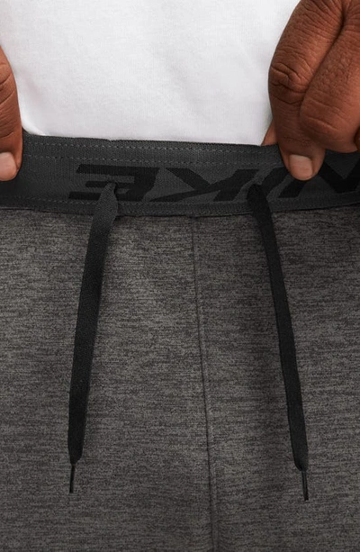 Shop Nike Therma-fit Sweatpants In Charcoal Heather/ Grey/ Black