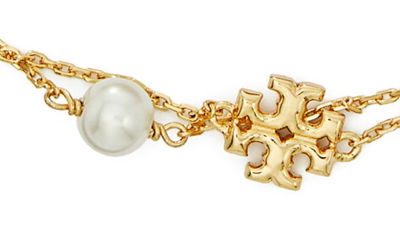 Shop Tory Burch Kira Imitation Pearl Double Strand Bracelet In Tory Gold/pearl/crystal