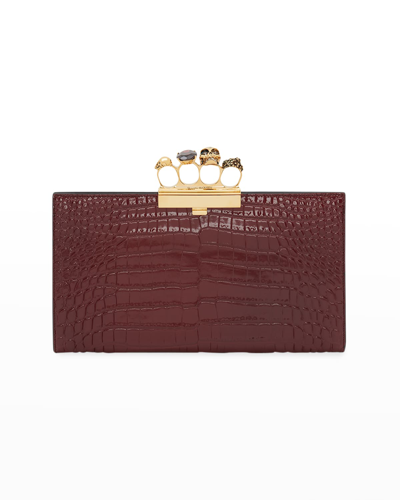 Shop Alexander Mcqueen Four-ring Stamped Crocodile Clutch Bag In Madder