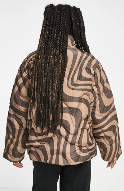 ASOS DESIGN puffer jacket in brown monogram print
