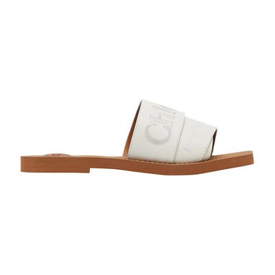 Shop Chloé Woody Slides In White