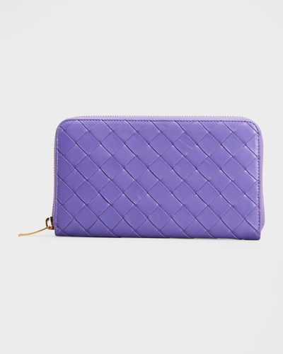 Shop Bottega Veneta Zip Around Napa Intrecciato Wallet In Purple/gold