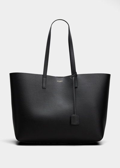 Shop Saint Laurent East West Calfskin Shopping Tote Bag In Black
