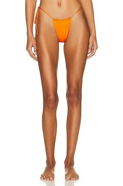 Shop Monica Hansen Beachwear Money Maker Side Tie String Bikini Bottom In Orange Slice
