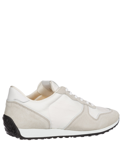 Shop Tod's Sneakers In White