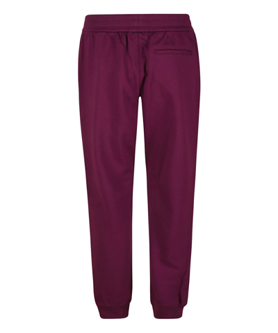 Shop Versace Sweatpants In Violet