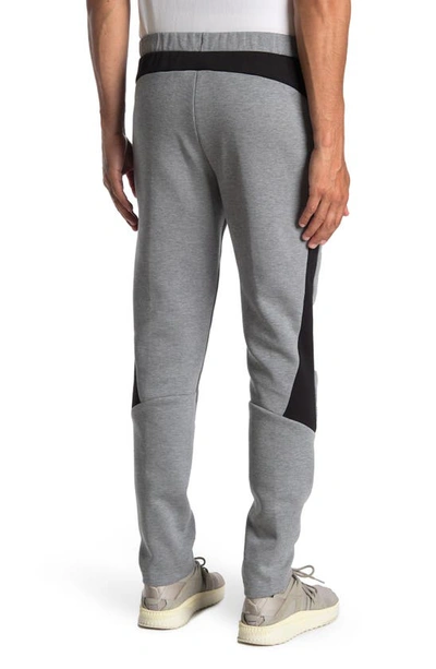 Shop Puma Evostripe Core Pants In Medium Gray Heather