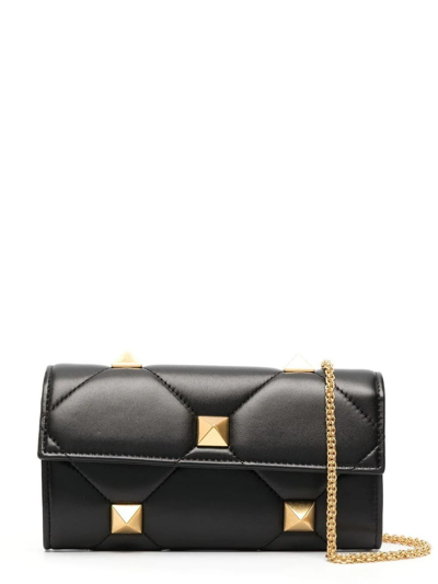 Shop Valentino Black Roman Stud Shoulder Bag With Gold Detailing In Nero