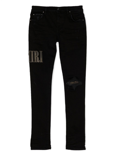 Shop Amiri Logo-print Detail Trousers In Black
