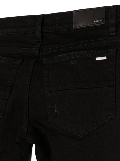 Shop Amiri Logo-print Detail Trousers In Black