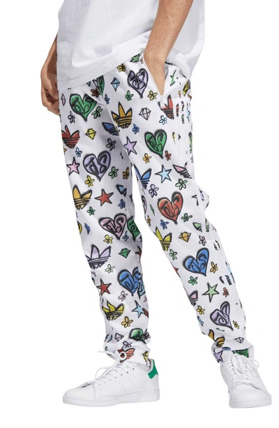 Shop Adidas Originals X Jeremy Scott Firebird Monogram Track Pants In White