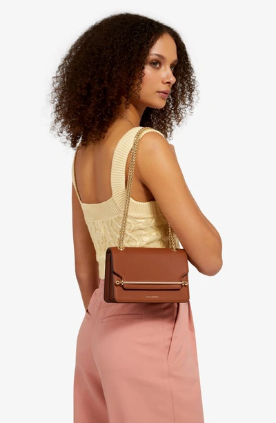 Shop Strathberry Mini East/west Leather Shoulder Bag In Chestnut