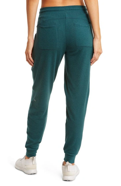 Shop Alo Yoga Soho Sweatpants In Midnight Green