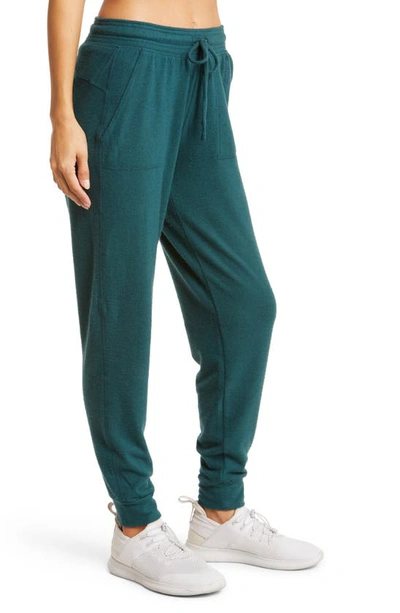 Shop Alo Yoga Soho Sweatpants In Midnight Green