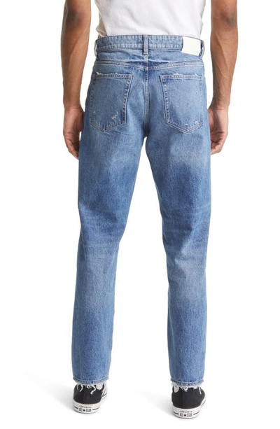 Shop Dl1961 Noah Tapered Straight Leg Jeans In Indigo Distressed