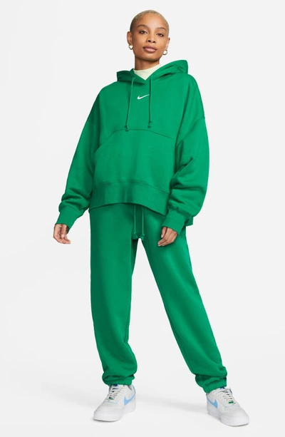 Shop Nike Sportswear Phoenix Fleece Pullover Hoodie In Malachite/ Sail