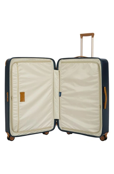 Shop Bric's Amalfi 32" Spinner Suitcase In Blue/ Tan
