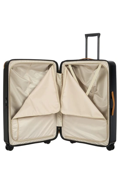 Shop Bric's Amalfi 32" Spinner Suitcase In Black/ Tan