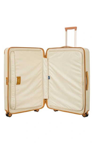 Shop Bric's Amalfi 32" Spinner Suitcase In Cream/ Tan
