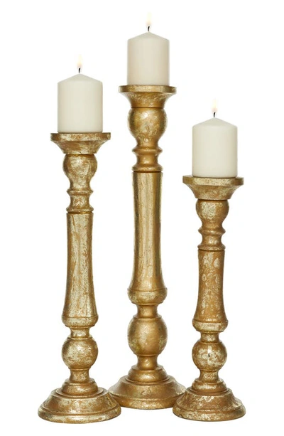 Shop Uma Goldtone Mango Wood Traditional Candle Holder In Multi