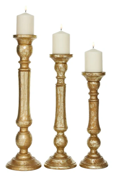 Shop Uma Goldtone Mango Wood Traditional Candle Holder In Multi