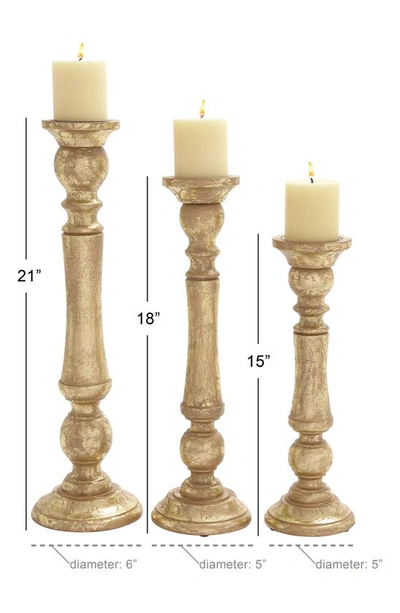 Shop Uma Goldtone Mango Wood Traditional Candle Holder In Multi