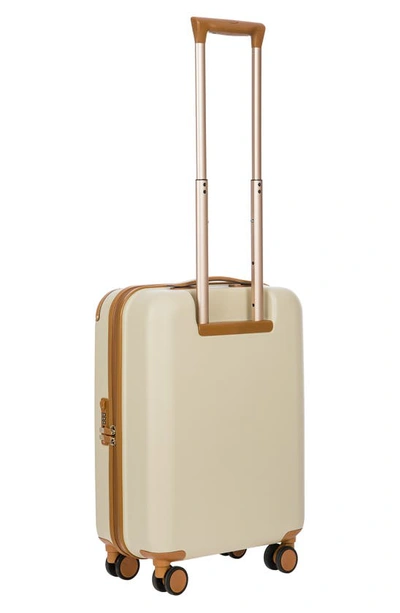 Shop Bric's Amalfi 21" Carry-on Spinner Suitcase In Cream/ Tan