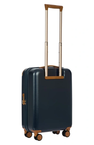 Shop Bric's Amalfi 21" Carry-on Spinner Suitcase In Blue/ Tan