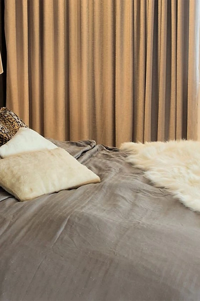 Shop Luxe Gordon Faux Sheepskin Throw In Off White