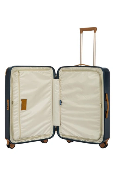 Shop Bric's Amalfi 27" Spinner Suitcase In Blue/ Tan