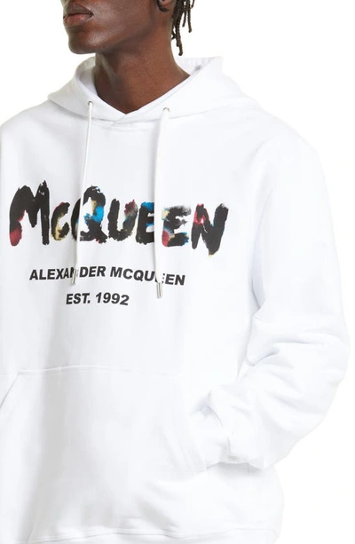 Shop Alexander Mcqueen Watercolor Graffiti Logo Cotton Graphic Hoodie In White/ Mix