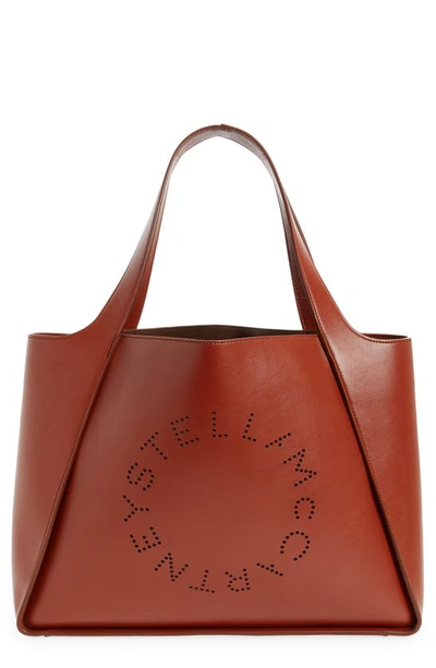 Shop Stella Mccartney Perforated Logo Faux Leather Tote In 2504 - Sierra